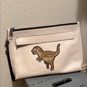 Coach White Clutch with Rexy Dinosaur Design